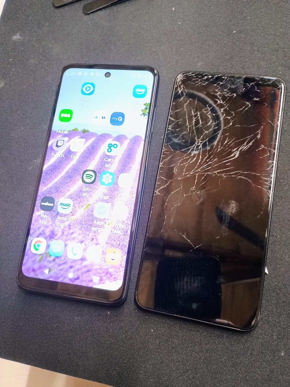 Repaired Moto G 5G powered on beside the removed cracked display.